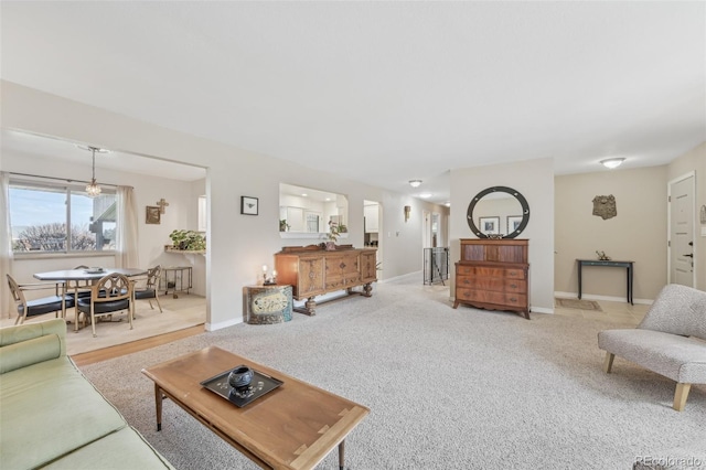 living area with carpet flooring and baseboards
