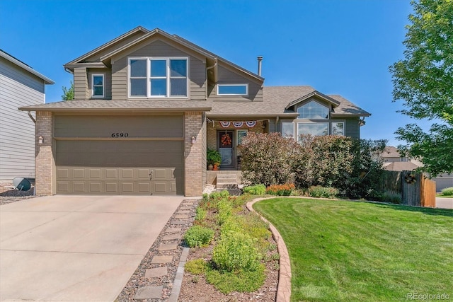 view of front facade featuring a garage and a front lawn