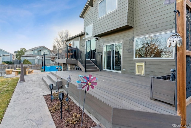 wooden terrace with a patio