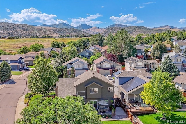 birds eye view of property featuring a mountain view