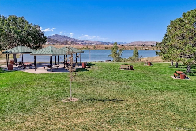 view of home's community featuring a yard, a gazebo, and a water and mountain view