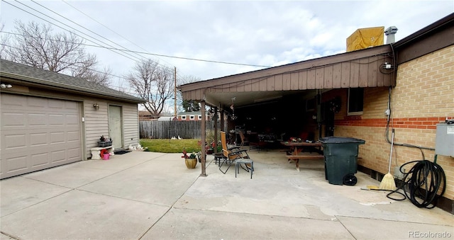 view of patio with a garage