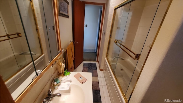 bathroom with combined bath / shower with glass door and tile patterned flooring