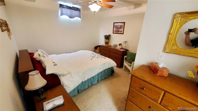 bedroom with ceiling fan and carpet floors