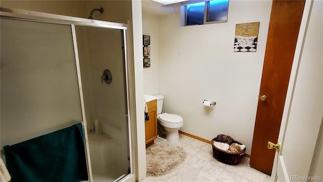 bathroom with vanity, toilet, and an enclosed shower