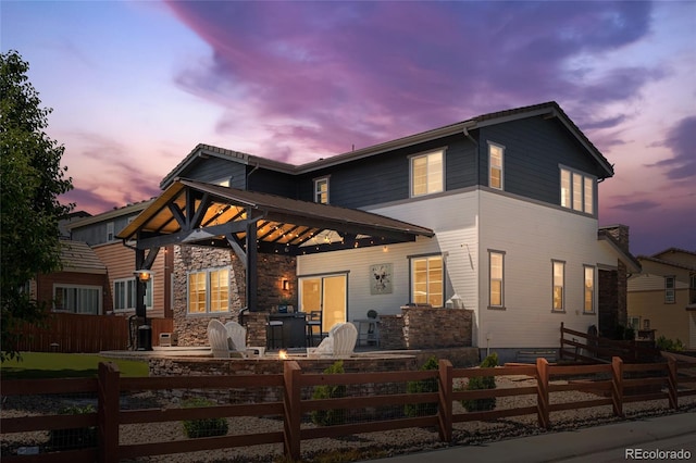 14110 Pastel Ln, Parker, CO 80134 - view of front of property featuring a fenced front yard and stone siding