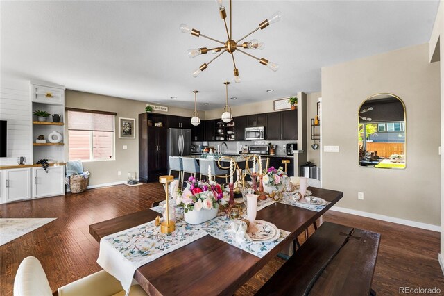 14110 Pastel Ln, Parker, CO 80134 - dining area featuring dark wood-style flooring and a chandelier