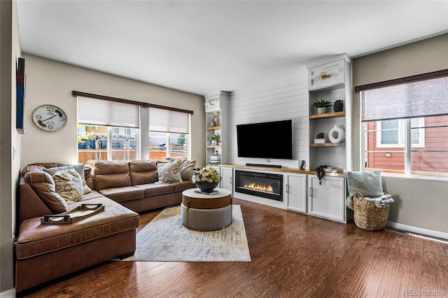 14110 Pastel Ln, Parker, CO 80134 - living room featuring dark wood finished floors and a glass covered fireplace