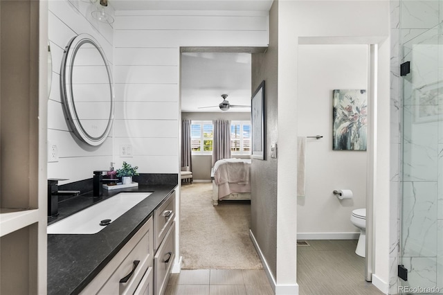 14110 Pastel Ln, Parker, CO 80134 - ensuite bathroom with vanity, a marble finish shower, a ceiling fan, and tile patterned flooring