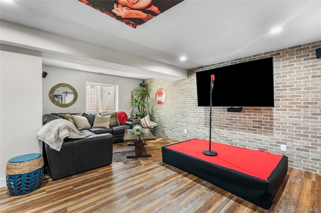 14110 Pastel Ln, Parker, CO 80134 - living area with brick wall, wood finished floors, and recessed lighting