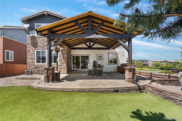 14110 Pastel Ln, Parker, CO 80134 - rear view of house with stone siding, a yard, and a patio area