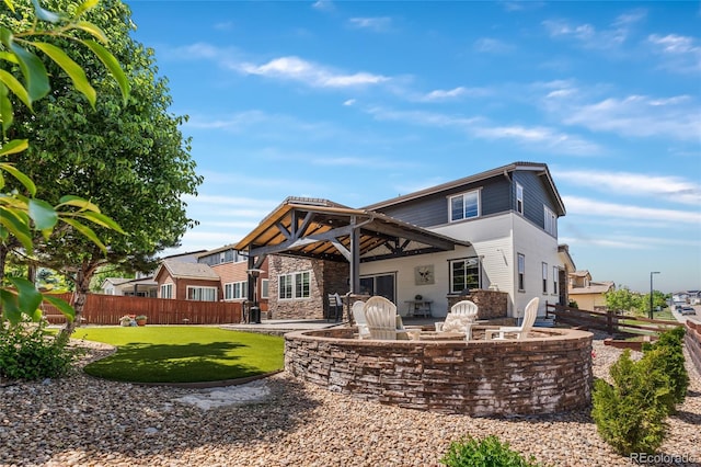 14110 Pastel Ln, Parker, CO 80134 - back of property featuring a patio area and stone siding