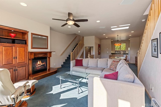 1508 Berino Ct Unit C, Frisco, CO 80443 - living area with stairway, a glass covered fireplace, dark colored carpet, recessed lighting, and ceiling fan