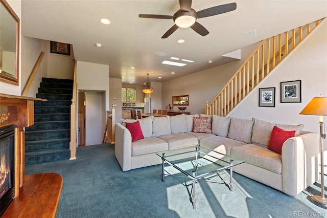 1508 Berino Ct Unit C, Frisco, CO 80443 - living area with stairs, carpet floors, a ceiling fan, a glass covered fireplace, and recessed lighting