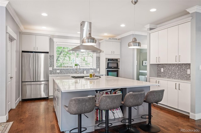 2746 Geneva St, Denver, CO 80238 - kitchen featuring stainless steel appliances, decorative backsplash, extractor fan, a center island, and light countertops