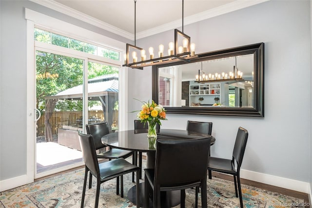 2746 Geneva St, Denver, CO 80238 - dining room with ornamental molding, a chandelier, and wood finished floors