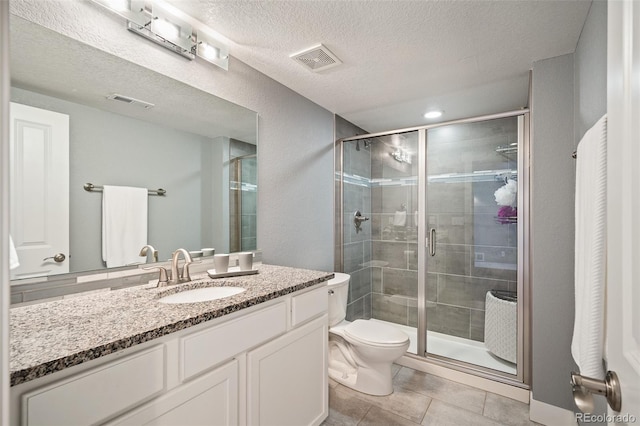 2746 Geneva St, Denver, CO 80238 - bathroom featuring vanity, a shower stall, tile patterned floors, and a textured ceiling