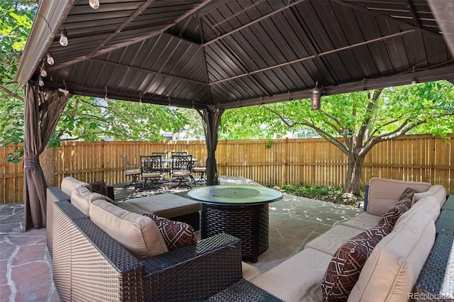 2746 Geneva St, Denver, CO 80238 - fenced backyard with outdoor lounge area, a gazebo, outdoor dining space, and a patio area