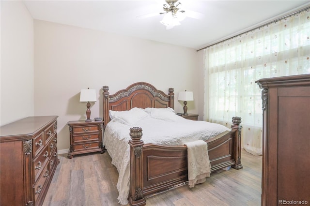 19249 E Progress Ave, Centennial, CO 80015 - bedroom with light wood-style flooring and ceiling fan