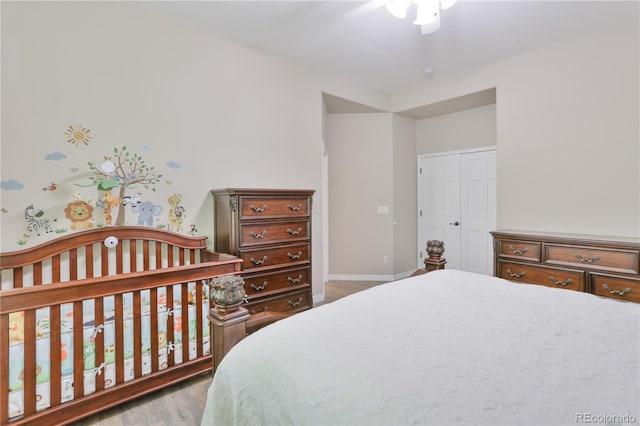 19249 E Progress Ave, Centennial, CO 80015 - bedroom featuring wood finished floors, a closet, and a ceiling fan