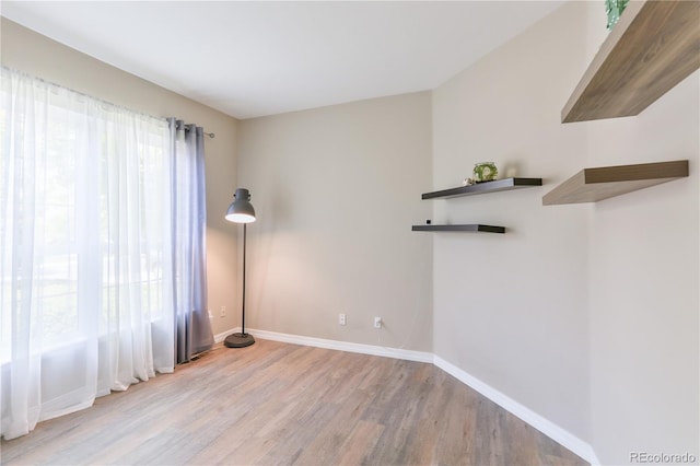 19249 E Progress Ave, Centennial, CO 80015 - empty room featuring wood finished floors and baseboards