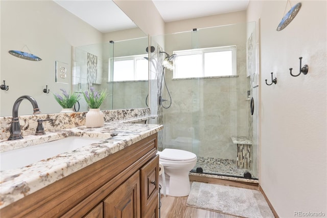19249 E Progress Ave, Centennial, CO 80015 - bathroom with vanity, a stall shower, and wood finished floors