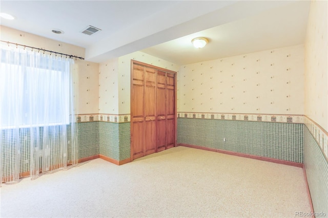 19249 E Progress Ave, Centennial, CO 80015 - empty room featuring wallpapered walls, wainscoting, and carpet floors