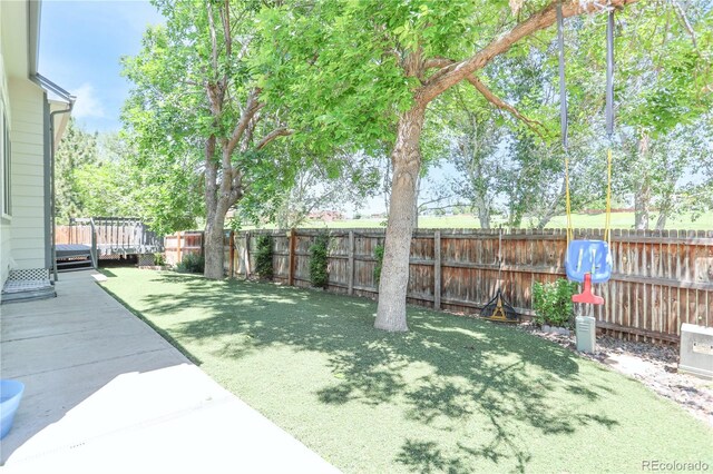 19249 E Progress Ave, Centennial, CO 80015 - fenced backyard with a wooden deck