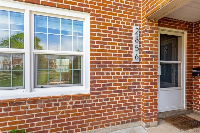 2856 Jasmine St, Denver, CO 80207 - doorway to property featuring brick siding