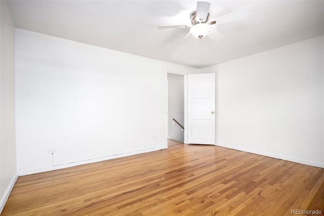 2856 Jasmine St, Denver, CO 80207 - empty room with light wood finished floors, baseboards, and a ceiling fan
