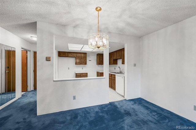13890 E Marina Dr Unit 304, Aurora, CO 80014 - kitchen with dishwasher, a sink, carpet floors, a chandelier, and a textured ceiling