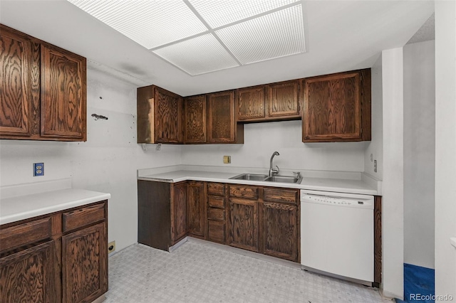 13890 E Marina Dr Unit 304, Aurora, CO 80014 - kitchen featuring white dishwasher, a sink, light flooring, dark brown cabinets, and light countertops