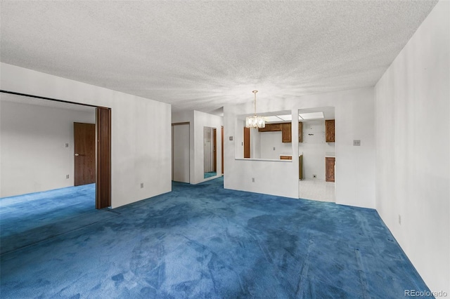 13890 E Marina Dr Unit 304, Aurora, CO 80014 - unfurnished living room featuring a chandelier, carpet, and a textured ceiling