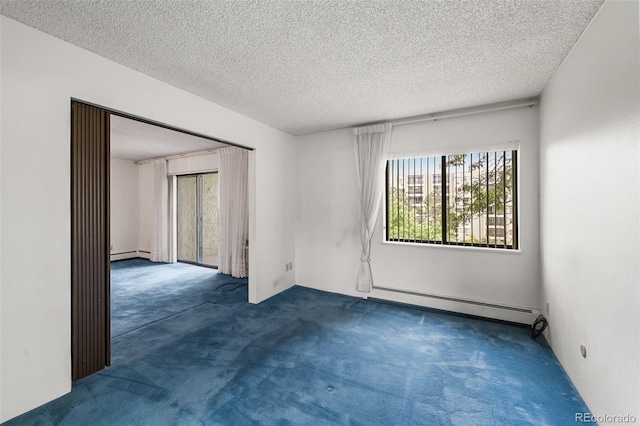 13890 E Marina Dr Unit 304, Aurora, CO 80014 - unfurnished room featuring baseboard heating, carpet floors, and a textured ceiling