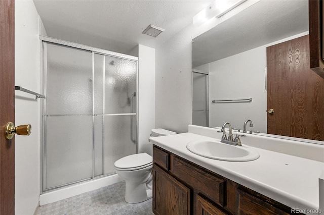 13890 E Marina Dr Unit 304, Aurora, CO 80014 - full bathroom with vanity, a stall shower, toilet, and tile patterned floors