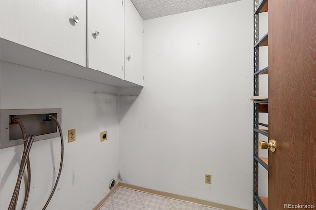 13890 E Marina Dr Unit 304, Aurora, CO 80014 - laundry room with cabinet space, electric dryer hookup, hookup for a washing machine, a textured ceiling, and tile patterned floors