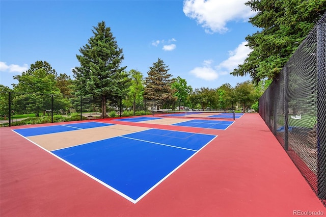 13890 E Marina Dr Unit 304, Aurora, CO 80014 - view of tennis court with community basketball court and view of wooded area