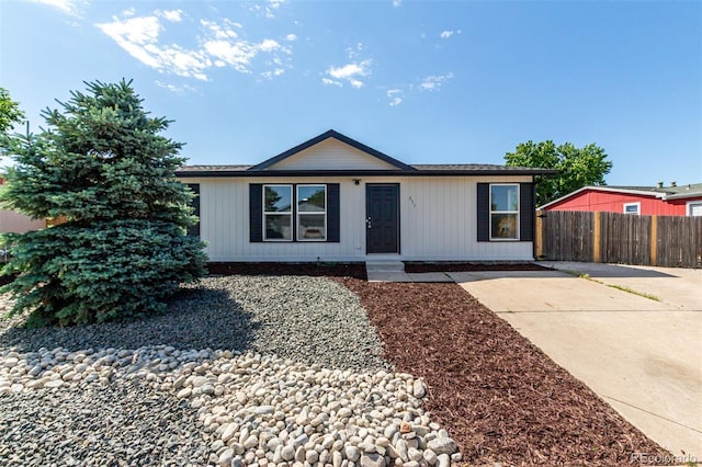 657 Locust Ave, Lochbuie, CO 80603 - view of front of house with concrete driveway