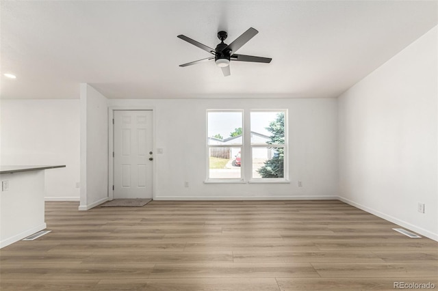 657 Locust Ave, Lochbuie, CO 80603 - unfurnished living room featuring light wood-style floors, ceiling fan, and recessed lighting