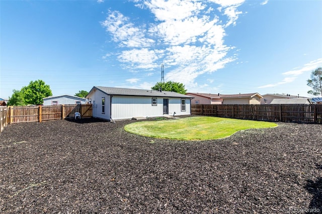 657 Locust Ave, Lochbuie, CO 80603 - rear view of house with a fenced backyard