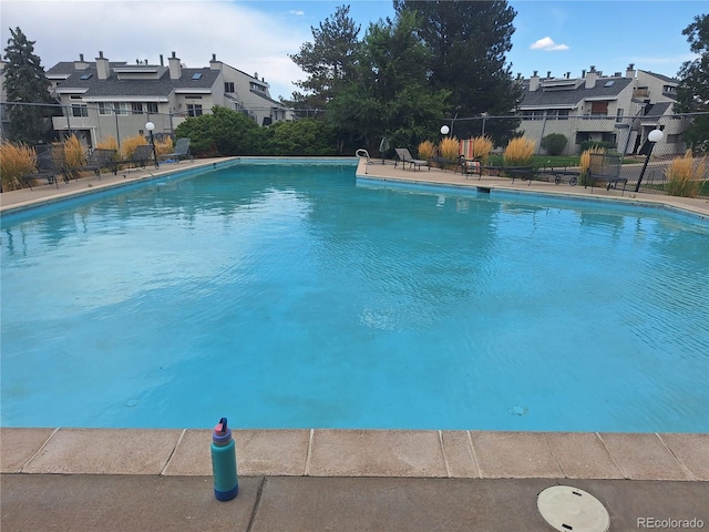 1845 N Kendall St Unit 316D, Lakewood, CO 80214 - view of swimming pool featuring fence