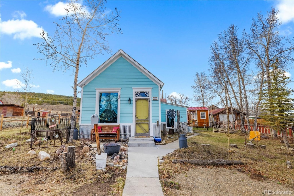 521 E 5th St, Leadville, CO 80461 - shotgun-style home with fence