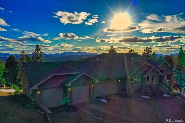 exterior space featuring a mountain view and a garage