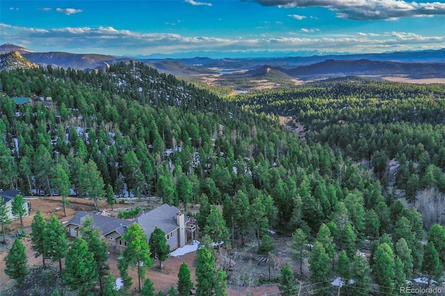 birds eye view of property with a mountain view