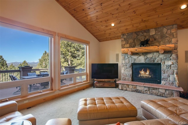 living room with vaulted ceiling, carpet, a stone fireplace, and wooden ceiling