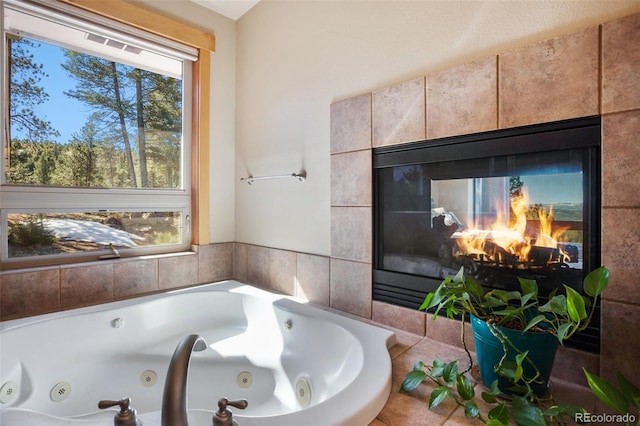 bathroom featuring a multi sided fireplace