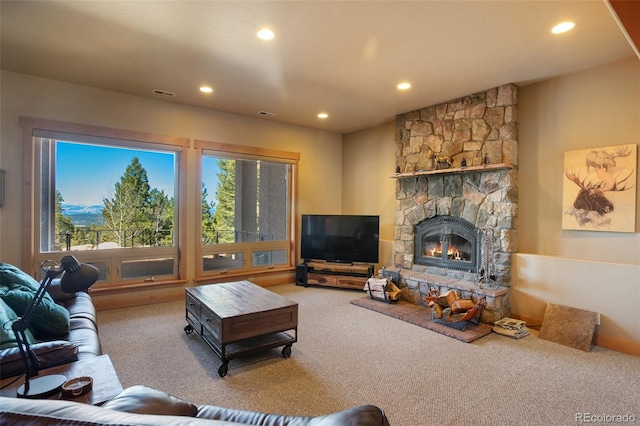 carpeted living room with a fireplace