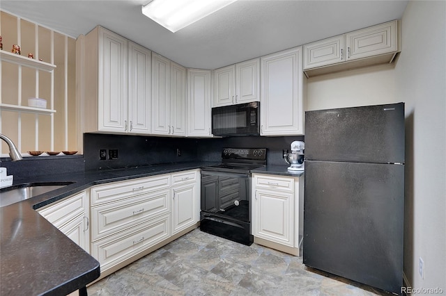 kitchen with white cabinets, sink, and black appliances