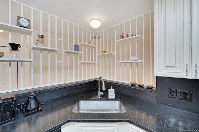 interior details with sink and white cabinets