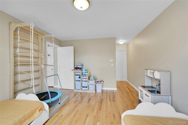 bedroom with light hardwood / wood-style flooring